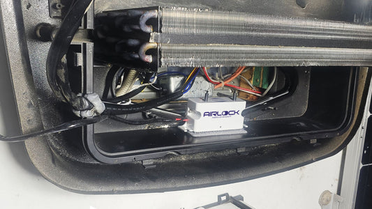 AIRLOCK unit installed inside an RV rooftop air conditioner compartment
