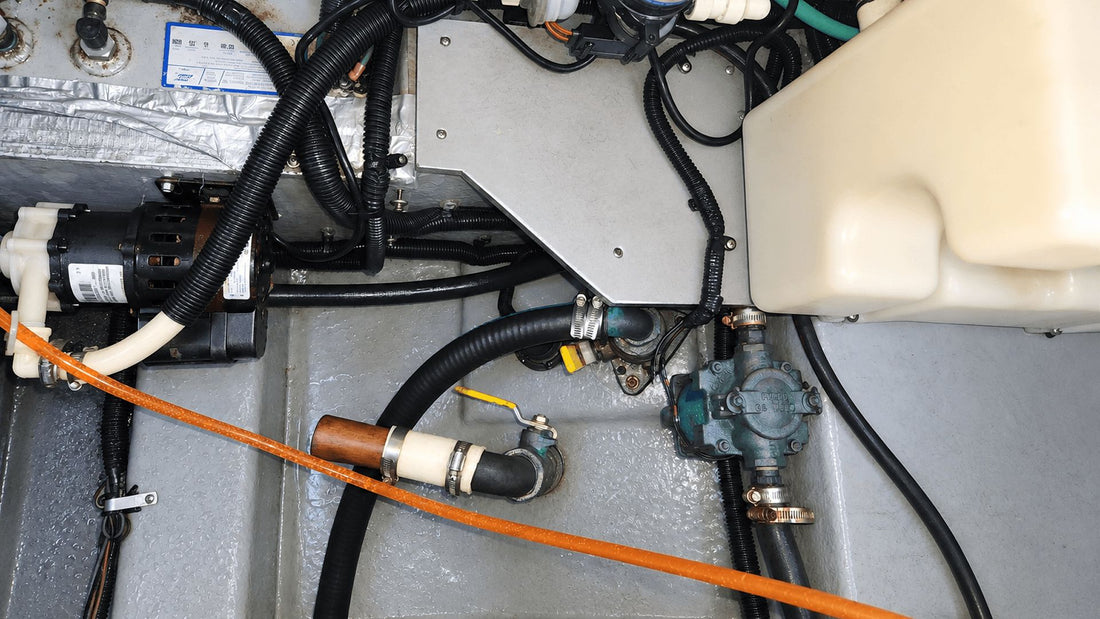 Open boat bilge compartment with pumps and hoses
