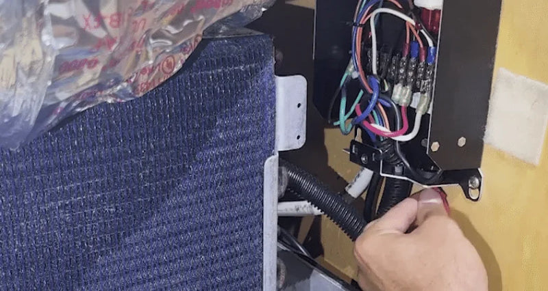 Hands wiring AIRLOCK One to the AC power