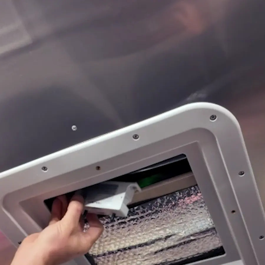 AIRLOCK One being placed into an RV rooftop AC ceiling unit